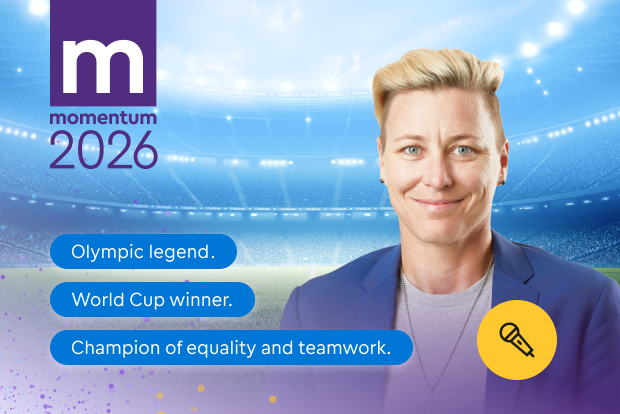 Momentum 2026 promotional graphic featuring Abby Wambach, a speaker, highlighted as an Olympic legend and World Cup winner.